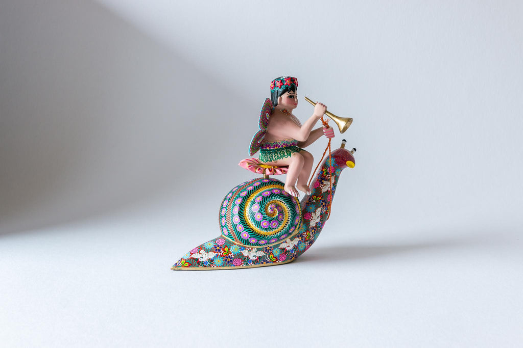 Fairy with Trumpet riding Snail